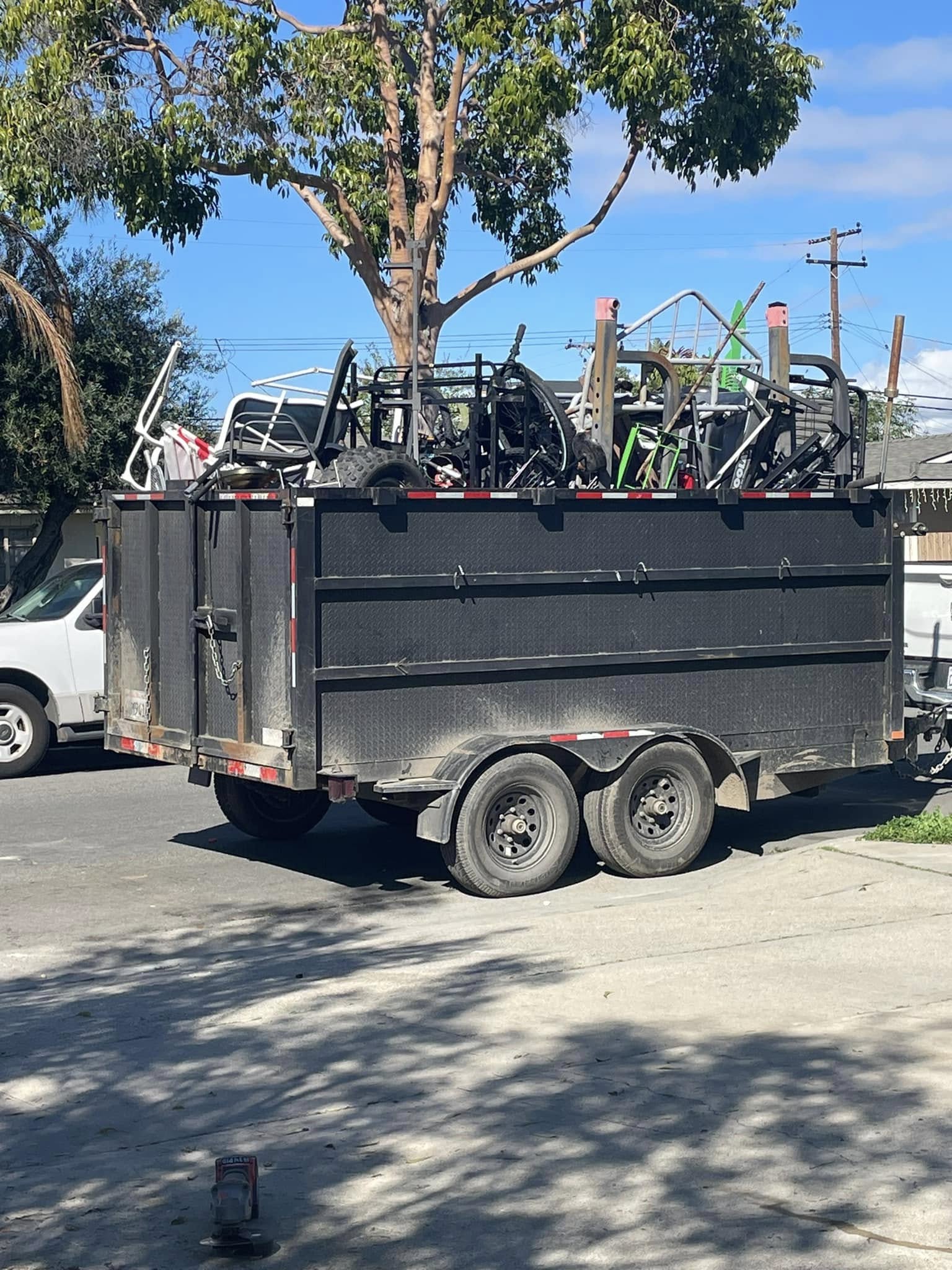 A Come Get It trailer loaded for junk removal